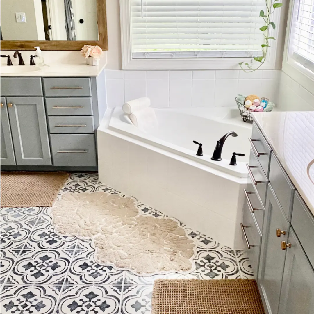 https://www.artsandclassy.com/wp-content/uploads/2023/06/DIY-Master-Bathroom-Makeover-How-to-Paint-Your-Tile-Floors-on-a-Budget-Feature-Image.webp